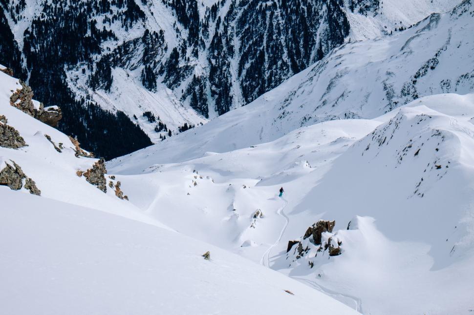 Free Image of Man Skiing Down Snow Covered Slope 