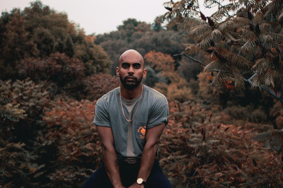Free Image of Bald Man Sitting on Bench 