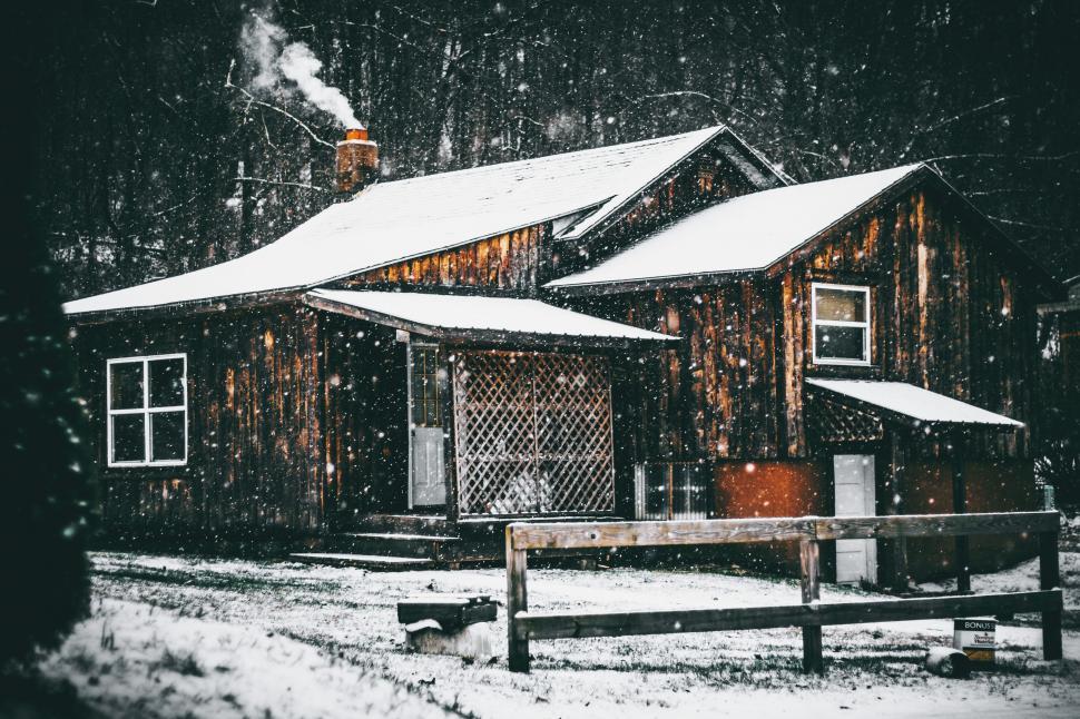 Free Image of Snow-Covered Cabin in the Woods 