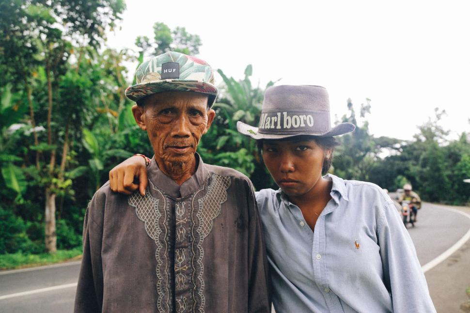 Free Image of Man and Woman Standing on Side of Road 
