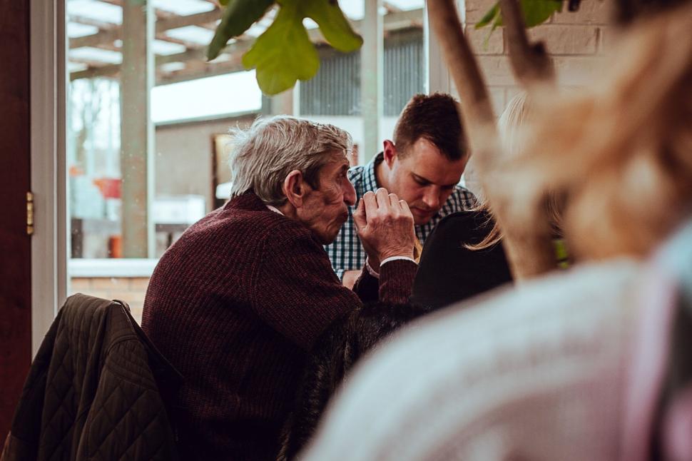 Free Image of A Man and a Woman Sitting Next to Each Other 