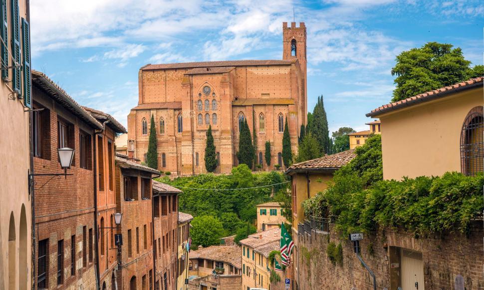 Free Image of Narrow Street With Church in Background 