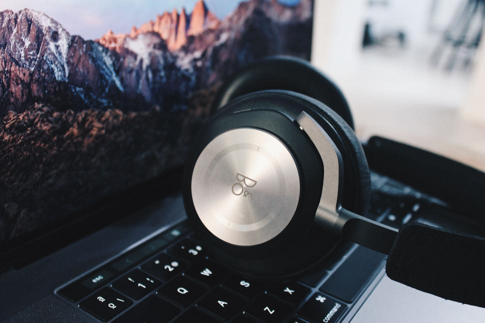 Free Image of Headphones Resting on Laptop 