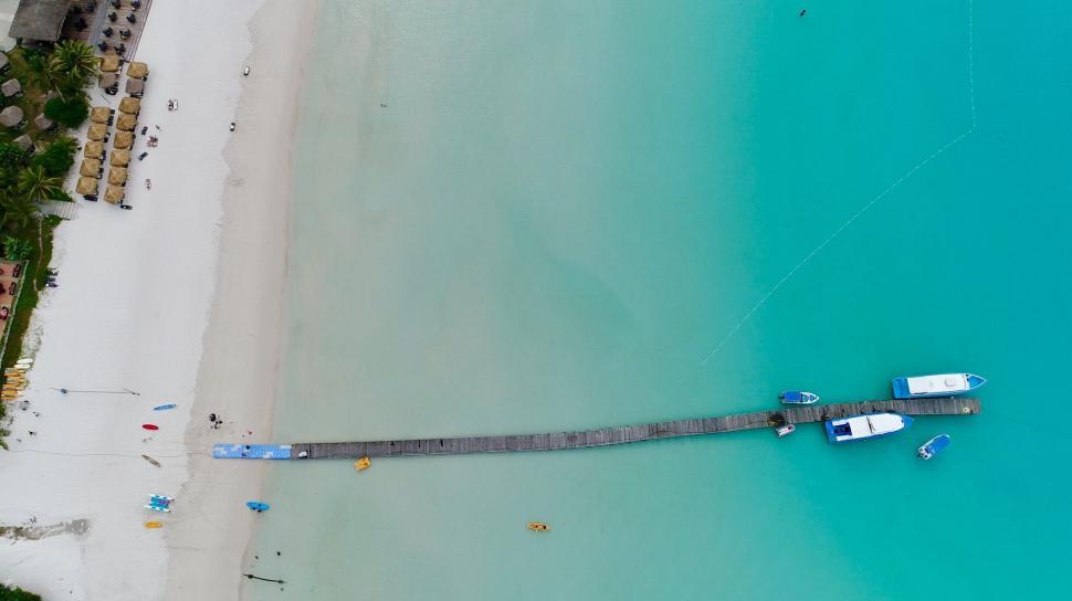 Free Image of Aerial View of a Beach With a Boat 
