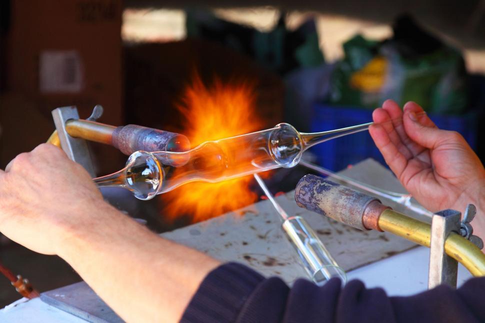 Free Image of Man Working on Metal Piece 
