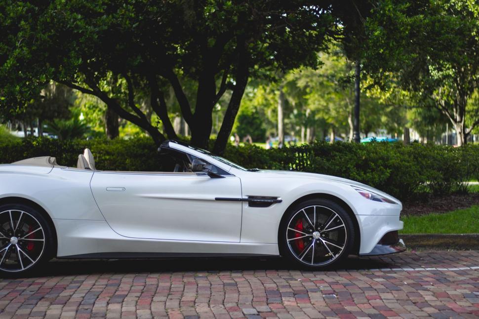 Free Image of White Sports Car Parked in Parking Lot 