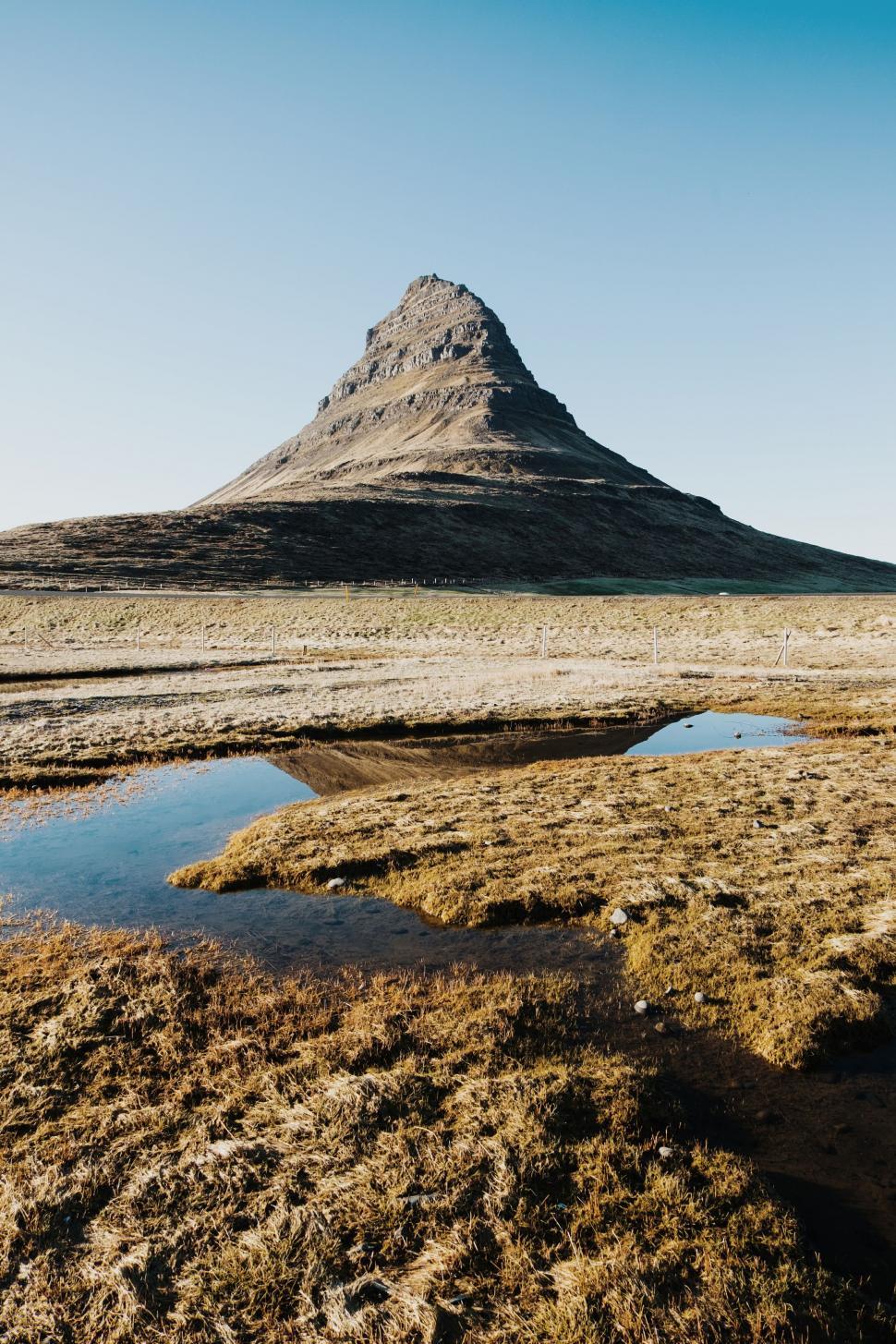 Free Image of Mountain View With Puddle in Foreground 