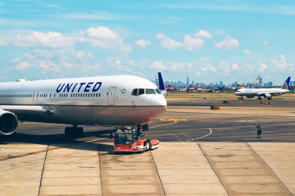 Free Image of Large Jetliner Parked on Airport Tarmac 