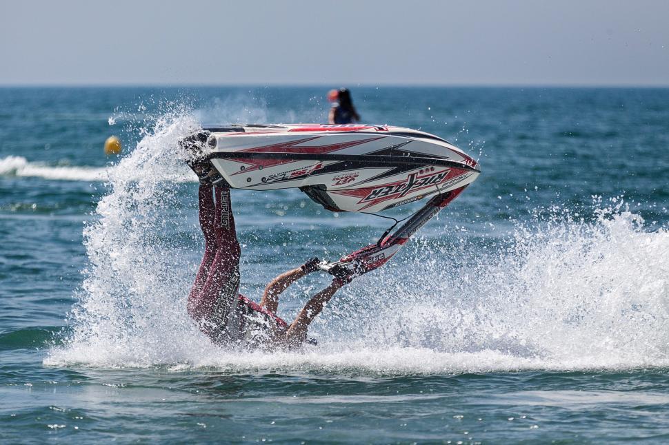 Free Image of Person Surfing on a Surfboard in the Ocean 
