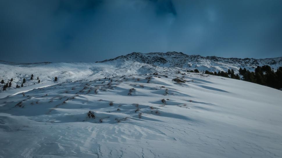 Free Image of Snowboarder Descending Snowy Mountain 