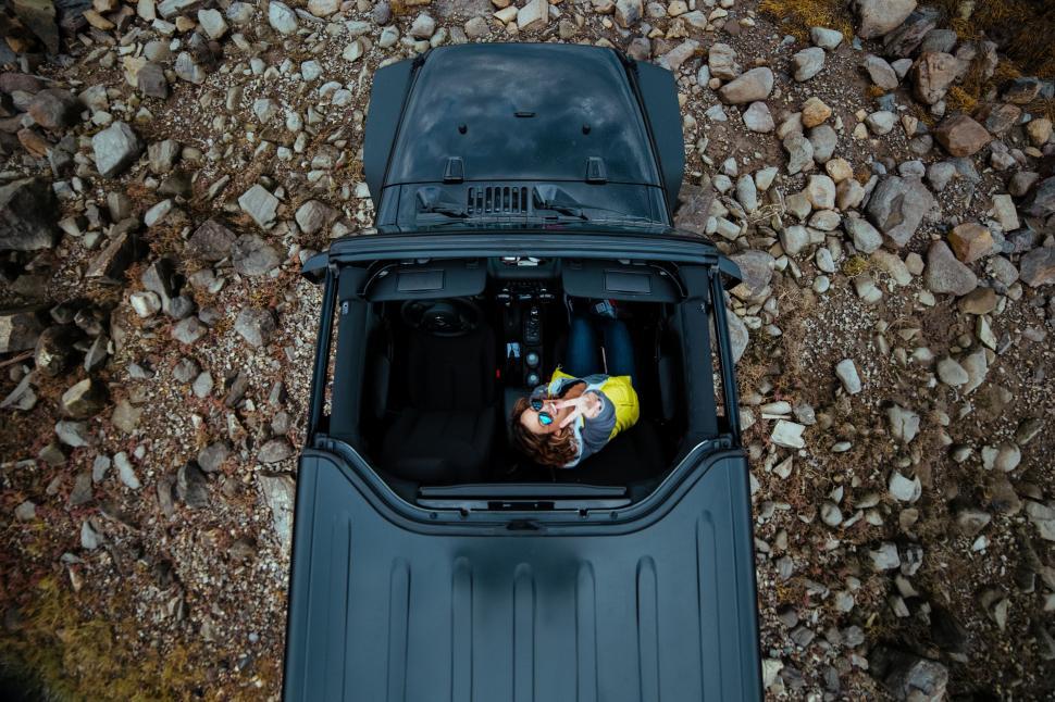 Free Image of Overhead View of Blue Truck With Rocks in Background 