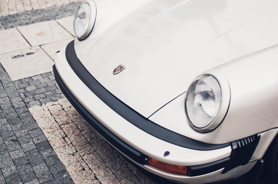 Free Image of White Car Parked on Side of Road 