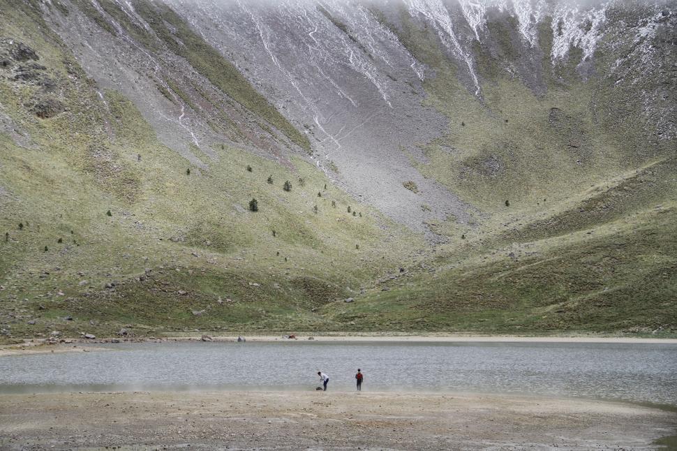 Free Image of People Standing by Water 