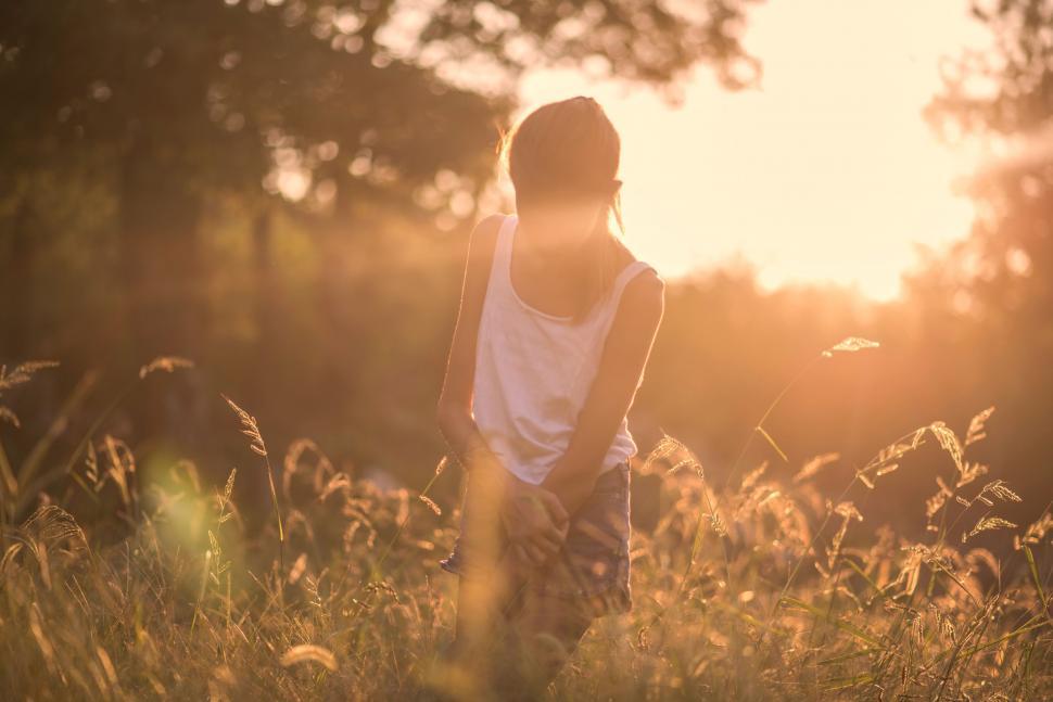 Free Image of Woman Standing in Tall Grass Field 
