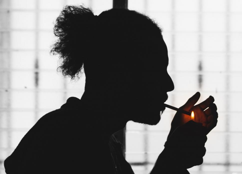 silhouette cigarette Free Stock Photo of Silhouette of Man Smoking Cigarette