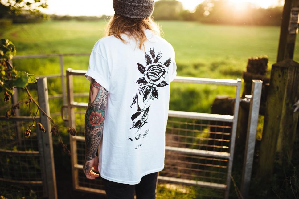 Free Image of Man With Long Hair Wearing White Shirt 
