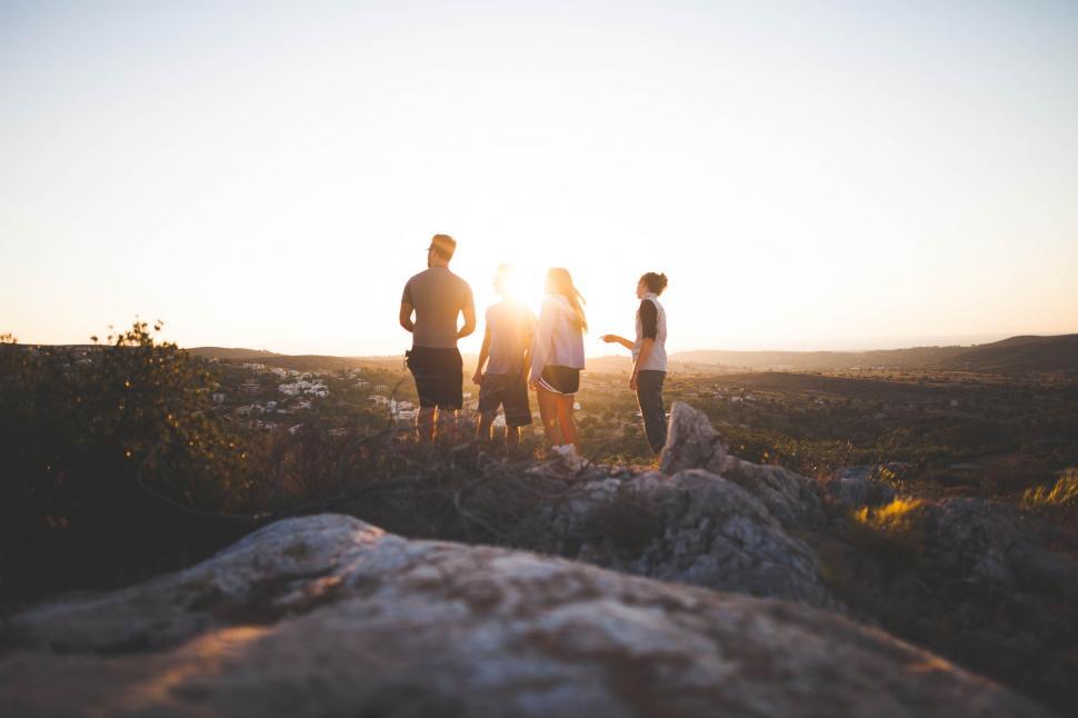 Free Image of Group of People Standing on Rocky Hillside 
