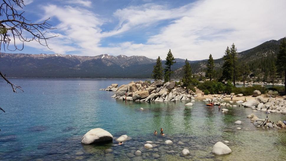 Free Image of Water Body Surrounded by Trees and Rocks 