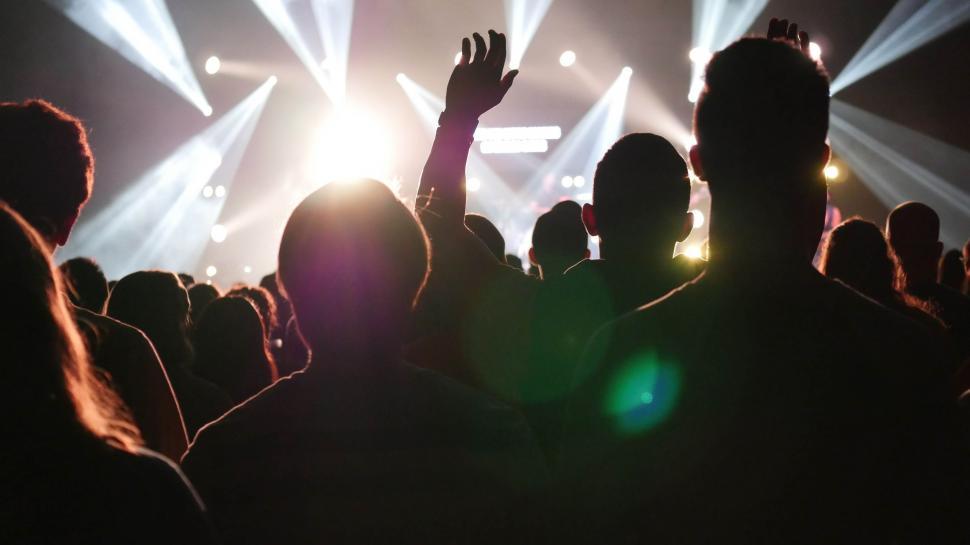Free Image of Crowd of People at Concert With Hands Raised 