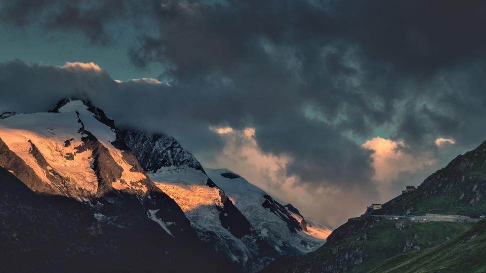 Free Image of Mountain Road Under Cloudy Sky 