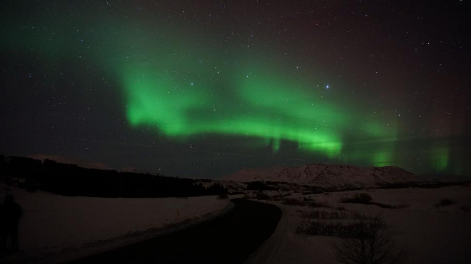Free Image of Green Light Shining in the Sky 