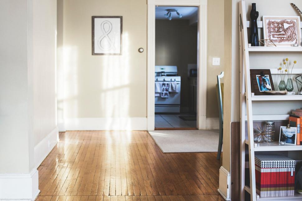 Free Image of Living Room With Hard Wood Floors and White Walls 