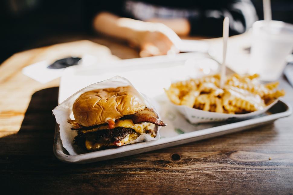Free Image of Two Trays of Food on a Wooden Table 