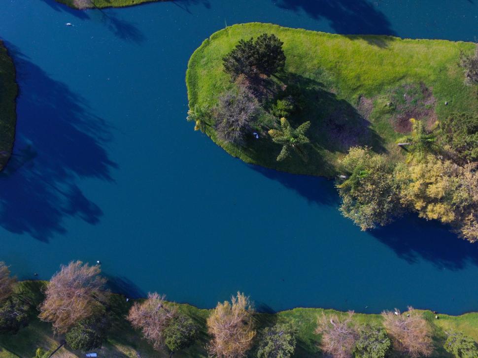 Free Image of Aerial View of a Lake Surrounded by Trees 
