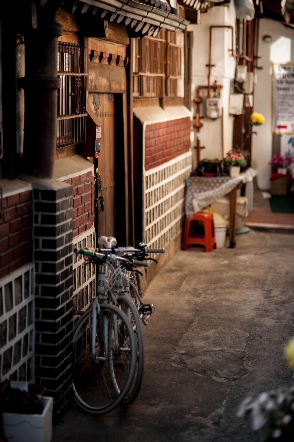 Free Image of Bike Parked in Garage Next to Brick Wall 