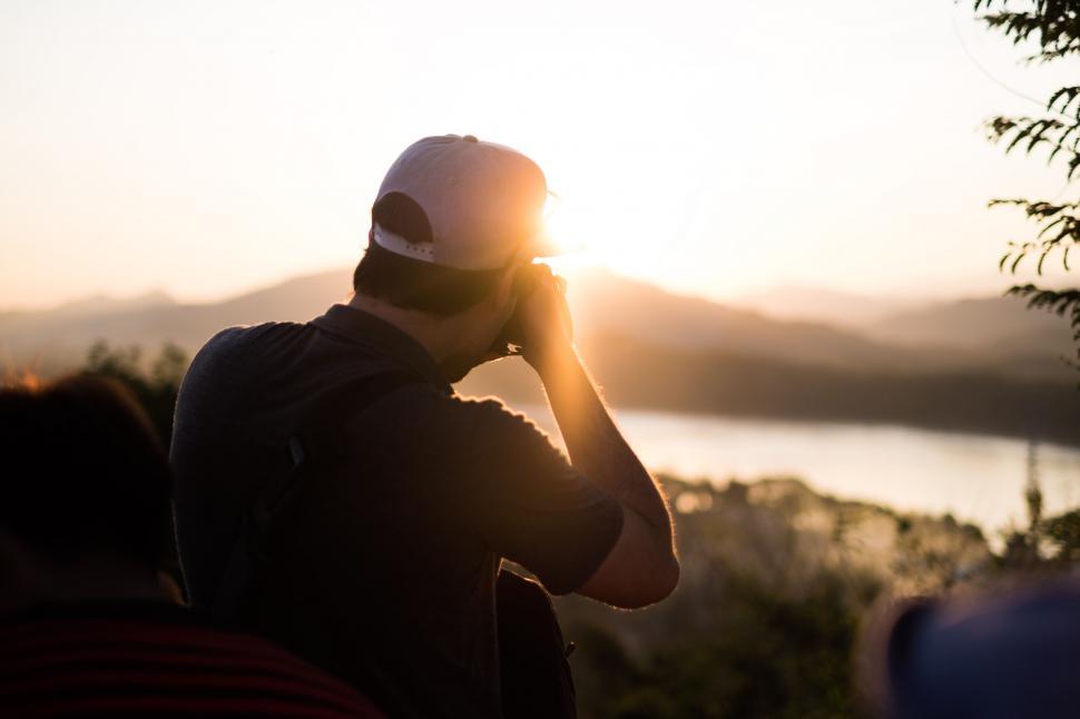 Free Image of Person Wearing Helmet Talking on Cell Phone 