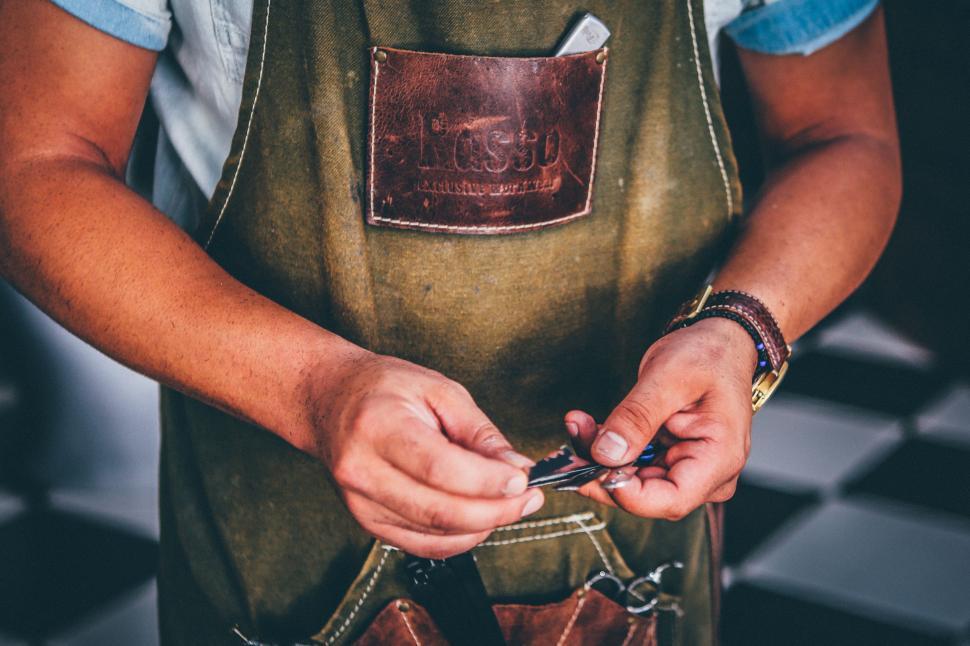 Free Image of Man Holding Pair of Scissors 