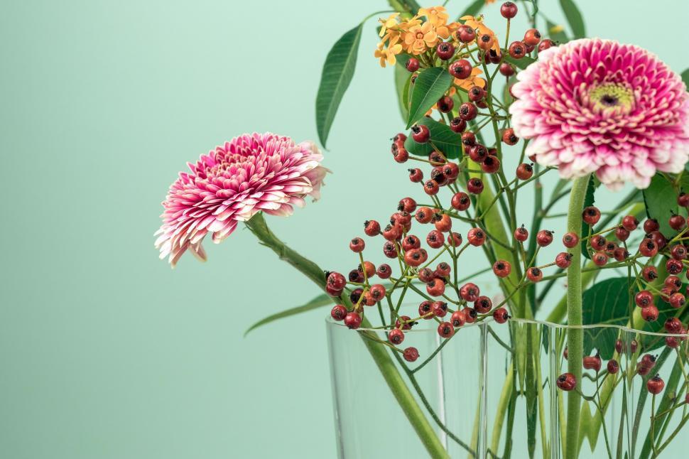 Free Image of Vase Filled With Pink and Yellow Flowers 