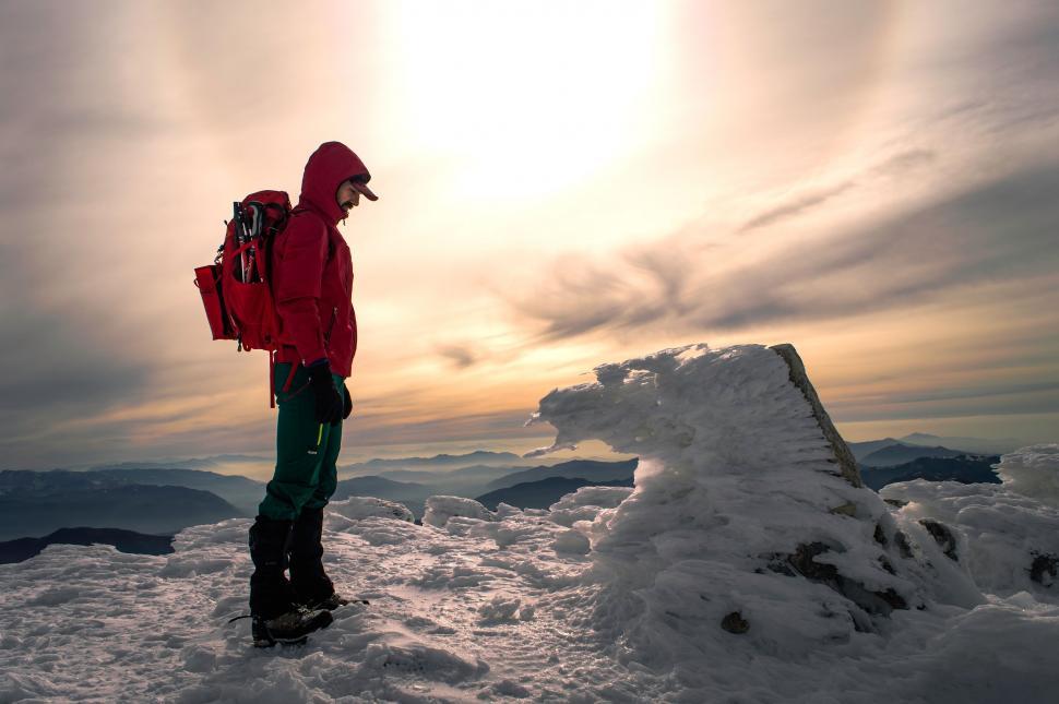 Free Image of Man Standing on Snow Covered Slope 