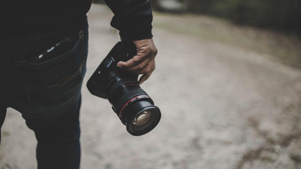 person-holding-camera-in-black-and-white.jpg