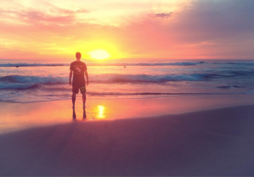 Young Man at Sunset on the Beach