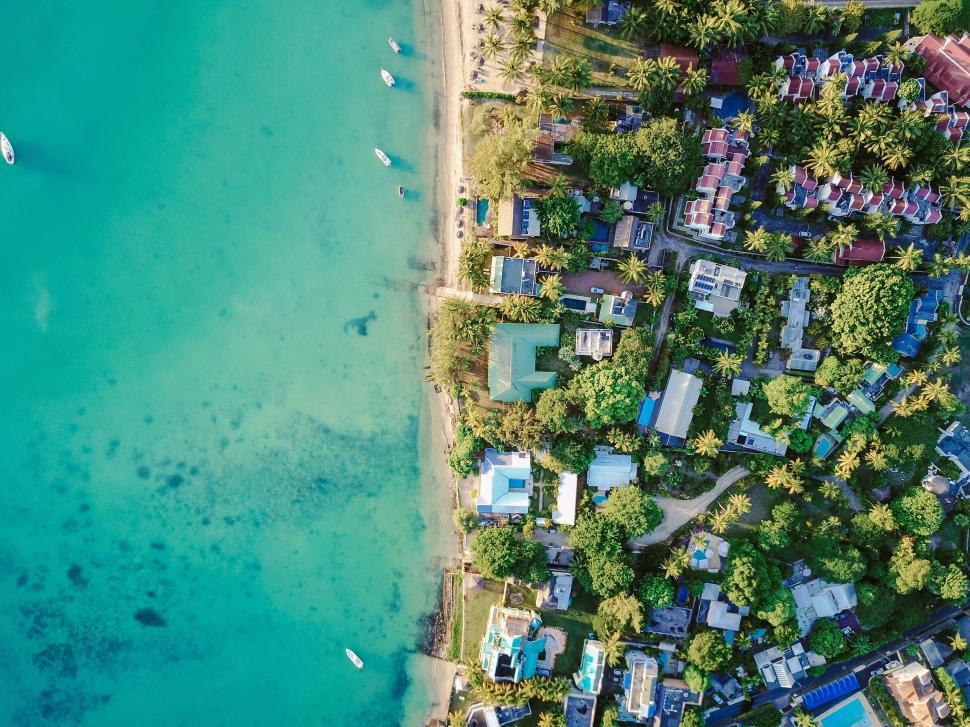 Free Image of Aerial View of Beach With Boats in Water 