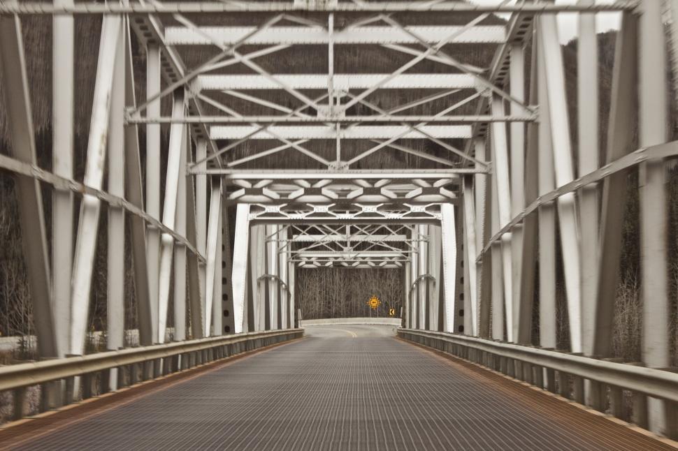 Free Image of Bridge Spanning River in Black and White 