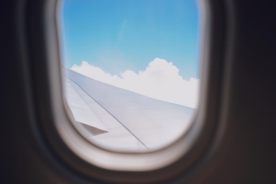 Free Image of Airplane Window View of Sky and Clouds 