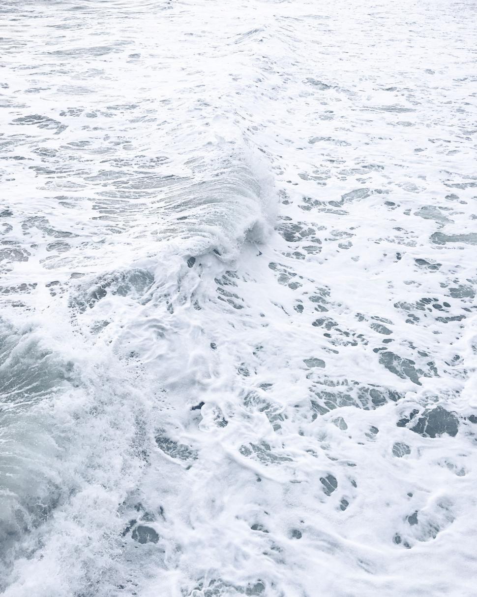 Free Image of Man Riding Wave on Surfboard 