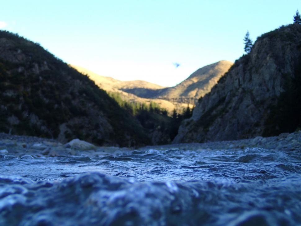 Free Image of River Flowing Through Mountainous Landscape 