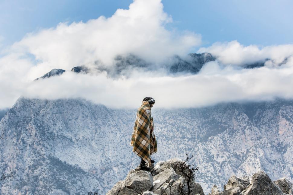 Free Image of Person Standing on Top of a Mountain 