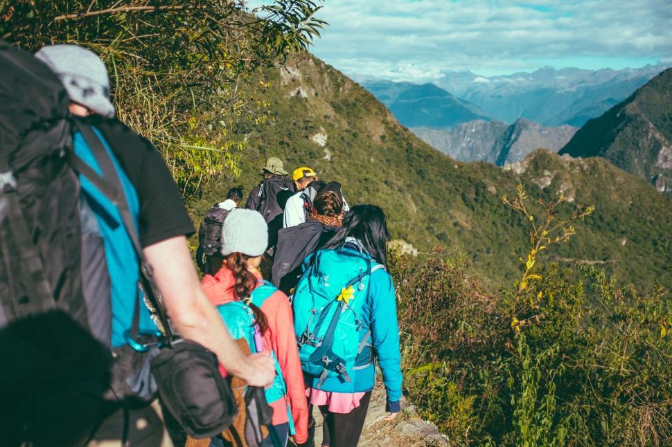 Free Image of Group of People Hiking Up a Mountain 