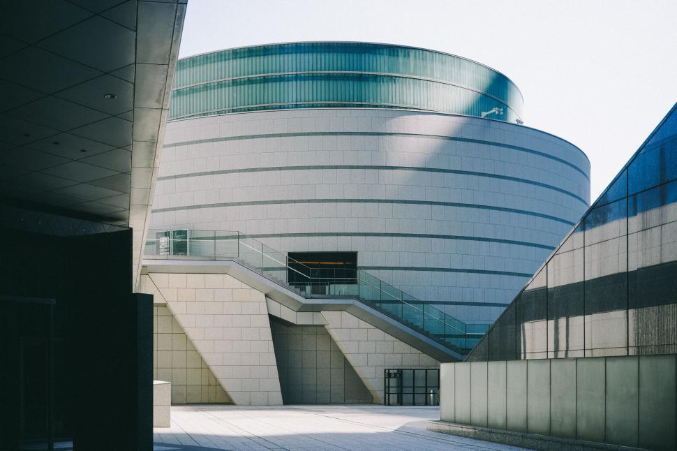Free Image of Building With Large Circular Window Next to Sidewalk 