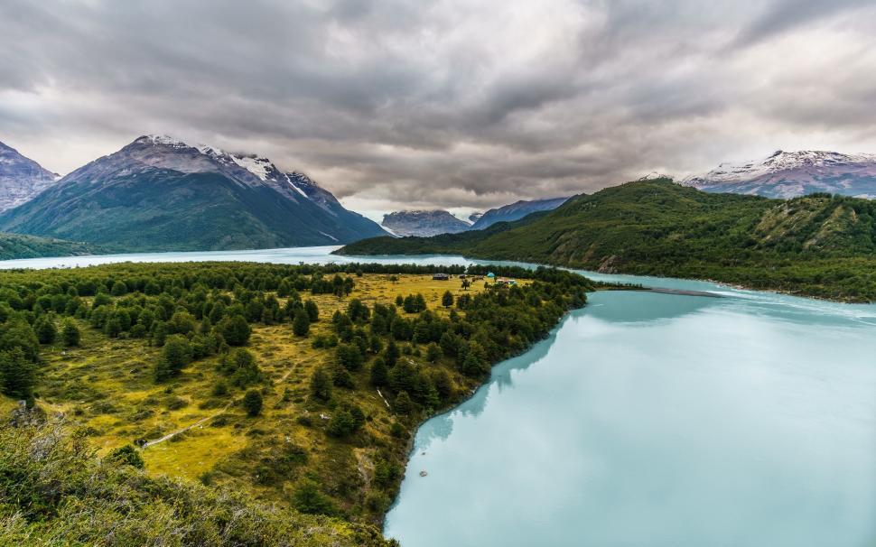 Free Image of Aerial View of a Lake Surrounded by Mountains 
