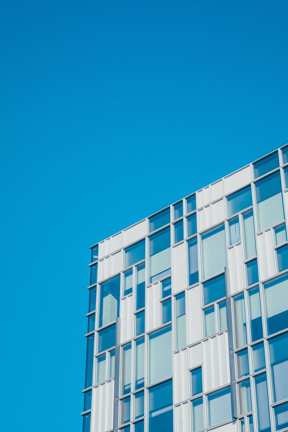 Free Image of Airplane Flying Over Building 