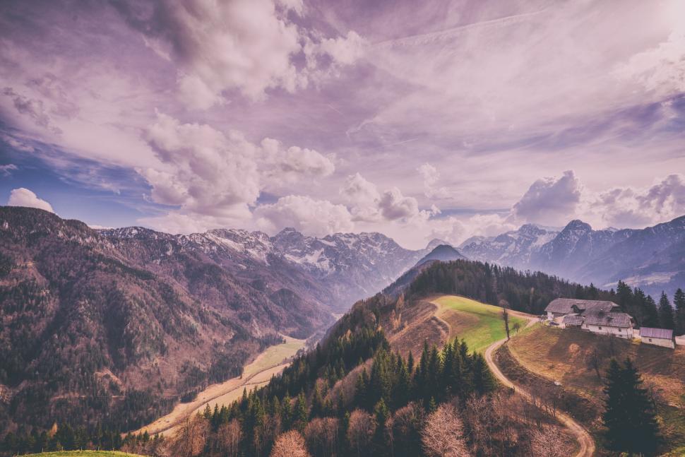 Free Image of Mountain Range With House in Foreground 