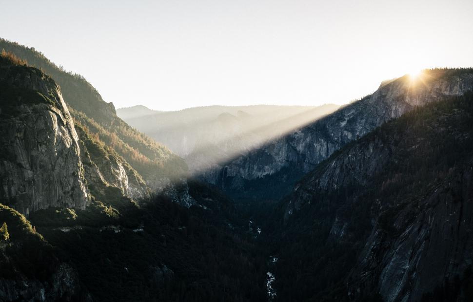 Free Image of The Sun Shines on the Mountains and Valleys 