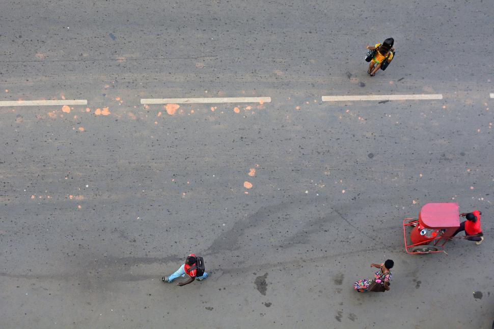 Free Image of Group of People Riding Motorcycles Down a Street 