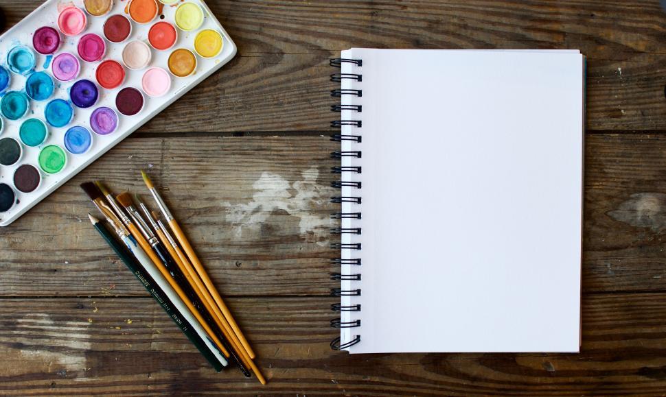 Free Image of Wooden Table With Paint and Notebook 