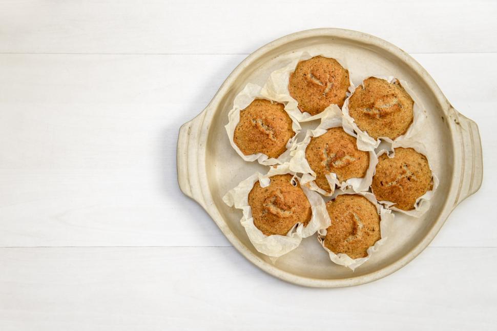 Free Image of White Plate With Cupcakes Covered in Frosting 